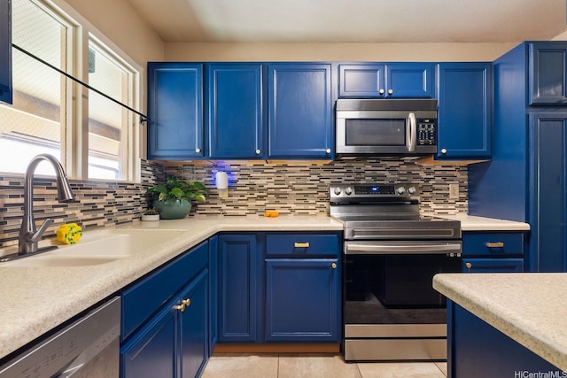 98-1369 Koaheahe Pl Unit 989, Pearl City, HI 96782 - kitchen with stainless steel appliances, a sink, blue cabinetry, and light countertops