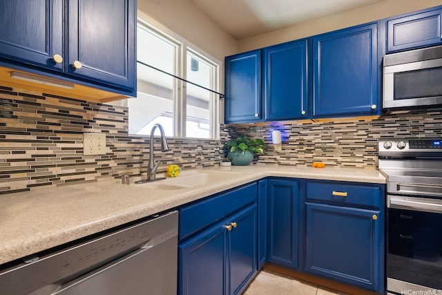 98-1369 Koaheahe Pl Unit 989, Pearl City, HI 96782 - kitchen featuring appliances with stainless steel finishes, blue cabinets, a sink, and backsplash