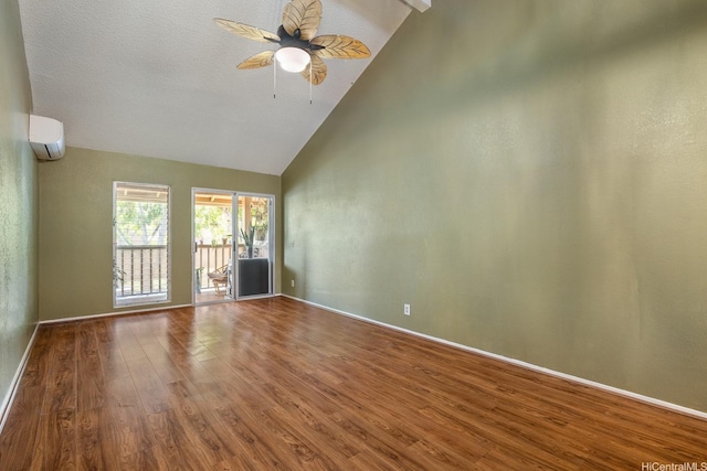 98-1369 Koaheahe Pl Unit 989, Pearl City, HI 96782 - unfurnished room featuring an AC wall unit, wood finished floors, baseboards, high vaulted ceiling, and a ceiling fan