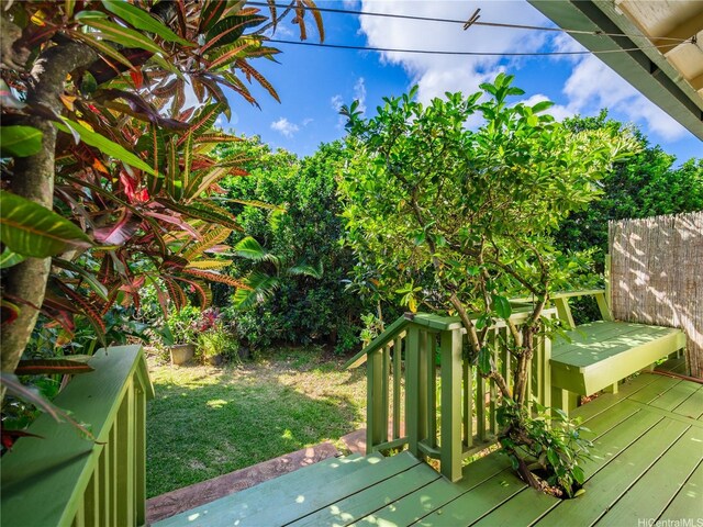 58-015 Maika Pl, Haleiwa, HI 96712 - wooden terrace featuring a lawn