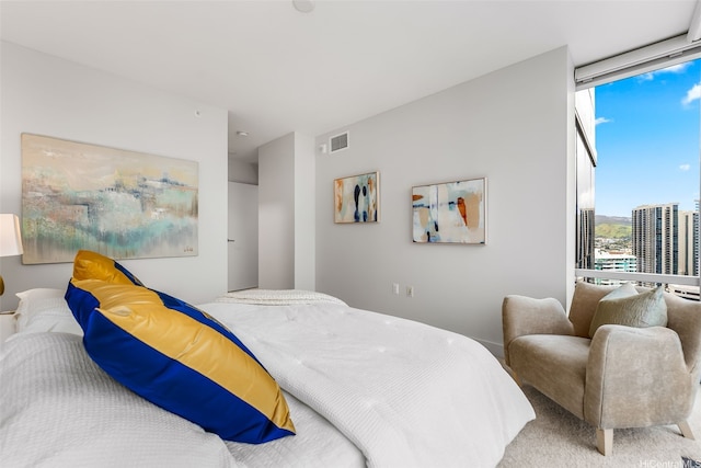 1189 Waimanu St Unit 3305, Honolulu, HI 96814 - bedroom with a wall of windows and carpet floors