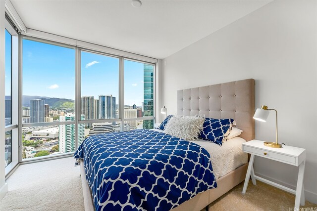 1189 Waimanu St Unit 3305, Honolulu, HI 96814 - carpeted bedroom with expansive windows and a city view
