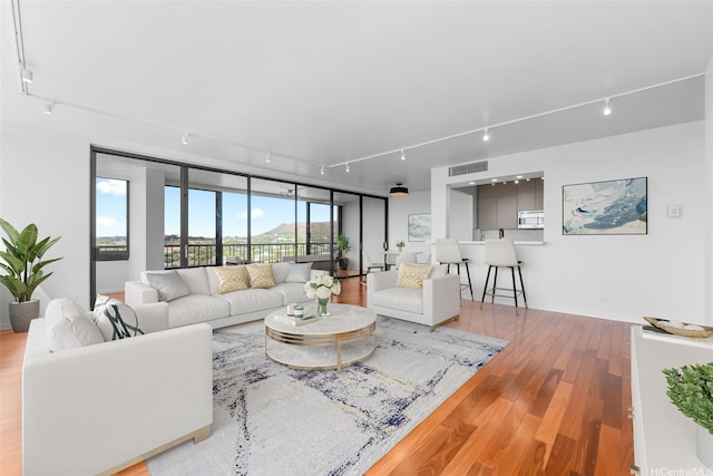 4340 Pahoa Ave Unit 7B, Honolulu, HI 96816 - living area with track lighting and wood finished floors