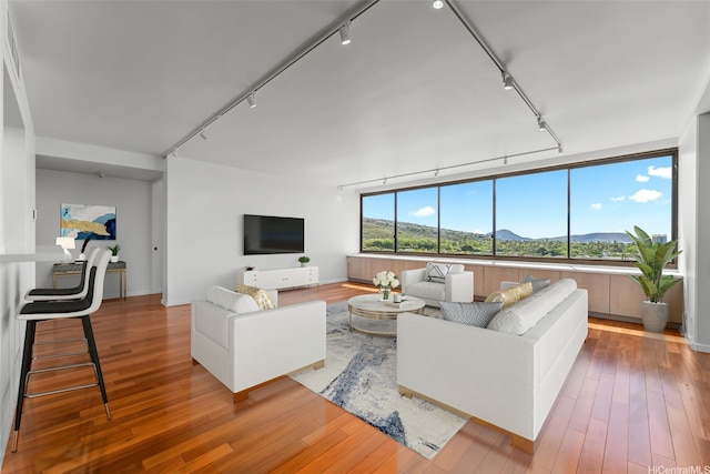 4340 Pahoa Ave Unit 7B, Honolulu, HI 96816 - living room with rail lighting and hardwood / wood-style floors