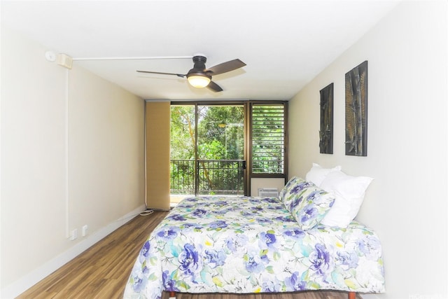 3138 Waialae Ave Unit 114, Honolulu, HI 96816 - bedroom with wood finished floors, baseboards, and ceiling fan