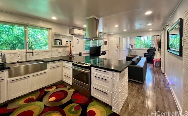 91-1708 Bond St, Ewa Beach, HI 96706 - kitchen featuring stainless steel electric range, a sink, island exhaust hood, dark wood-type flooring, and dark countertops