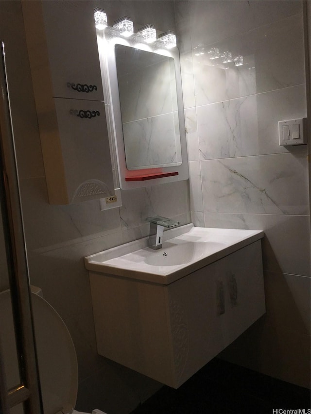 91-1708 Bond St, Ewa Beach, HI 96706 - half bathroom with tile walls, vanity, and backsplash
