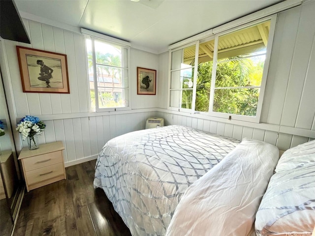 91-1708 Bond St, Ewa Beach, HI 96706 - bedroom featuring dark wood-style floors and wood walls