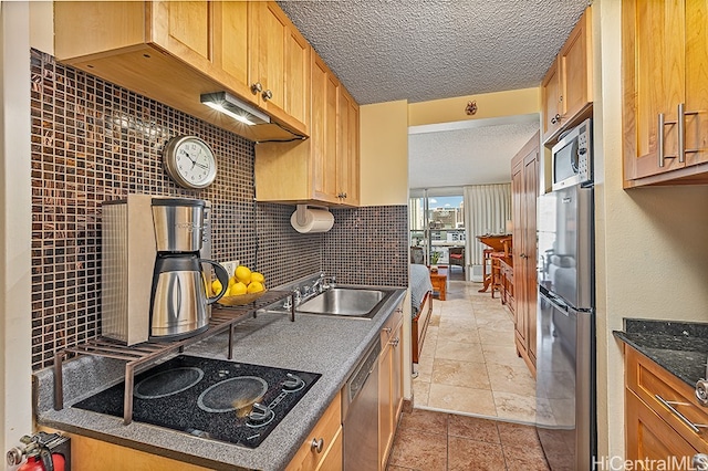 445 Seaside Ave Unit 1618, Honolulu, HI 96815 - kitchen with stainless steel dishwasher, black electric cooktop, a textured ceiling, a sink, and backsplash