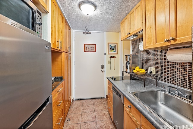 445 Seaside Ave Unit 1618, Honolulu, HI 96815 - kitchen featuring a sink, appliances with stainless steel finishes, dark countertops, decorative backsplash, and light tile patterned floors