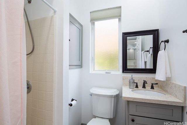 bathroom with vanity and curtained shower