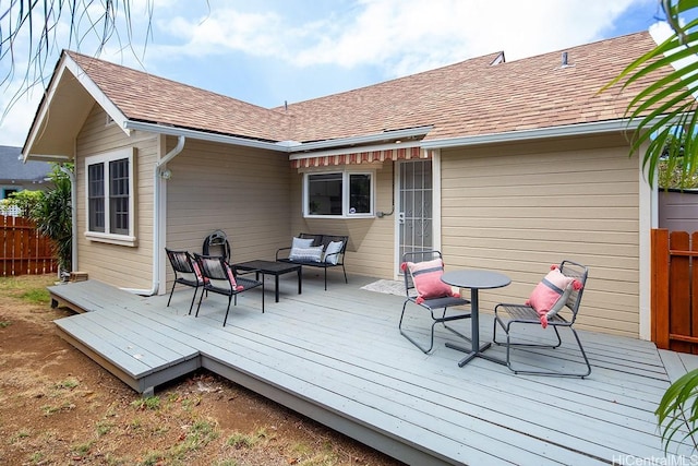 wooden deck featuring outdoor lounge area