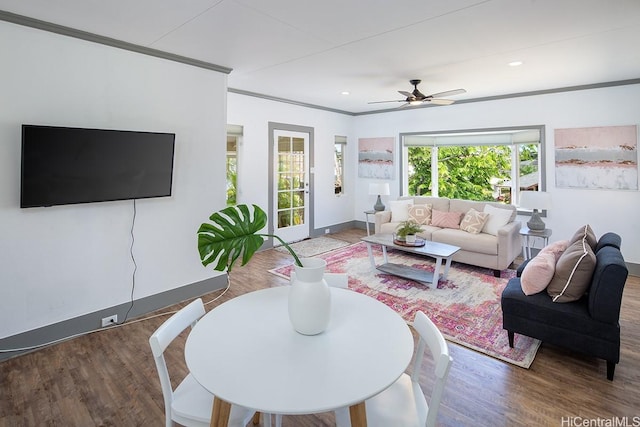 living area featuring wood finished floors, ceiling fan, crown molding, and recessed lighting