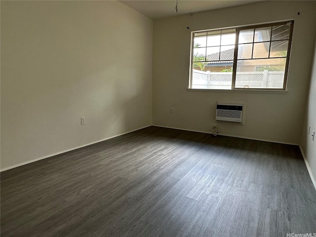 91-1191 Kaiau Ave Unit 1602, Kapolei, HI 96707 - spare room with dark wood-type flooring, baseboards, a wall mounted air conditioner, and heating unit