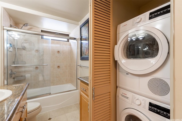 411 Hobron Ln Unit 3314, Honolulu, HI 96815 - laundry area featuring stacked washer / drying machine and tile patterned floors