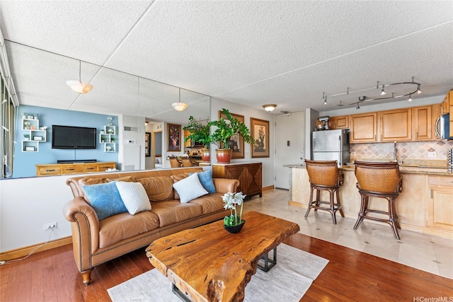 411 Hobron Ln Unit 3314, Honolulu, HI 96815 - living area featuring light wood-style floors and a textured ceiling