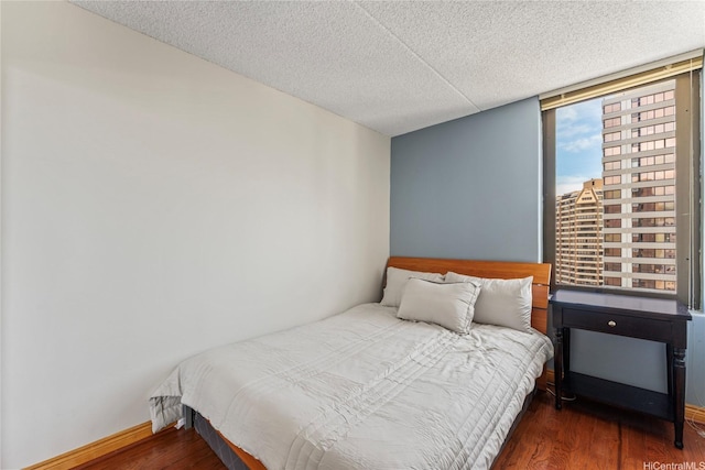 411 Hobron Ln Unit 3314, Honolulu, HI 96815 - bedroom featuring wood finished floors and a textured ceiling