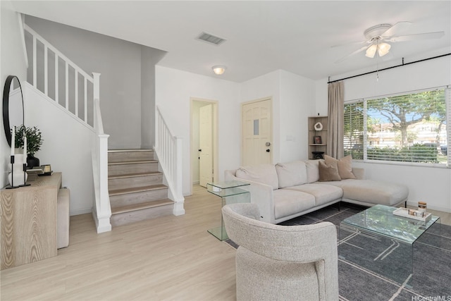 91-1059 Kaimalie St Unit 2P1, Ewa Beach, HI 96706 - living room with a ceiling fan, stairs, and light wood-style flooring