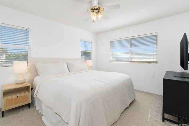 91-1059 Kaimalie St Unit 2P1, Ewa Beach, HI 96706 - bedroom with light colored carpet and a ceiling fan