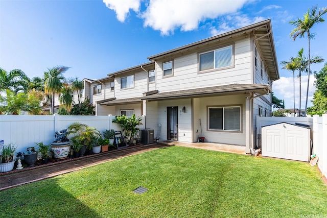 91-1059 Kaimalie St Unit 2P1, Ewa Beach, HI 96706 - view of front facade with a fenced backyard and a storage unit