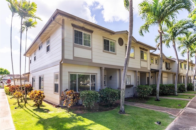 91-1059 Kaimalie St Unit 2P1, Ewa Beach, HI 96706 - townhome / multi-family property featuring a front yard