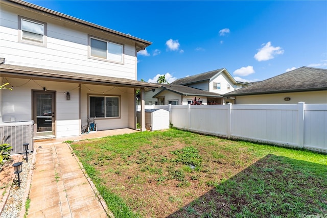 91-1059 Kaimalie St Unit 2P1, Ewa Beach, HI 96706 - rear view of house featuring a patio and a storage unit