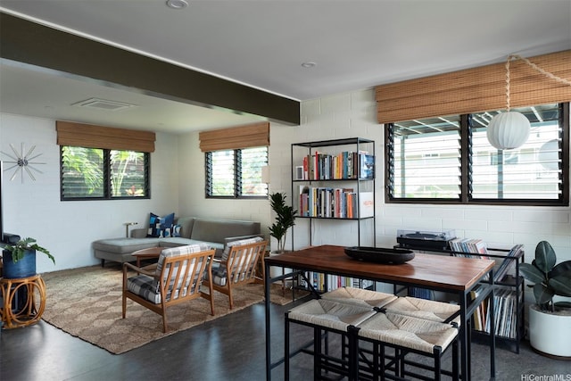 1875 Kualono St, Honolulu, HI 96817 - dining room featuring concrete block wall and finished concrete flooring