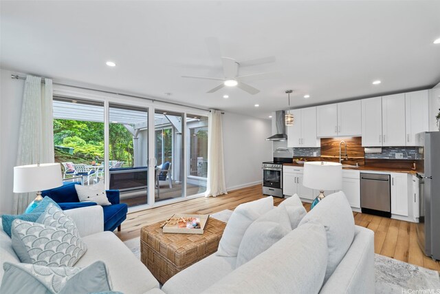 3657 Woodlawn Dr, Honolulu, HI 96822 - living area featuring a ceiling fan, light wood finished floors, and recessed lighting