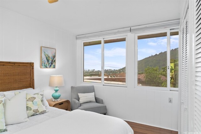 3657 Woodlawn Dr, Honolulu, HI 96822 - bedroom featuring multiple windows and wood finished floors