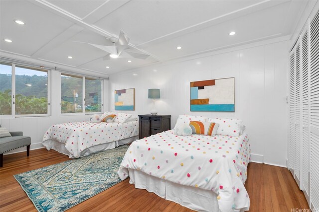 3657 Woodlawn Dr, Honolulu, HI 96822 - bedroom with wood finished floors, recessed lighting, ceiling fan, a closet, and coffered ceiling