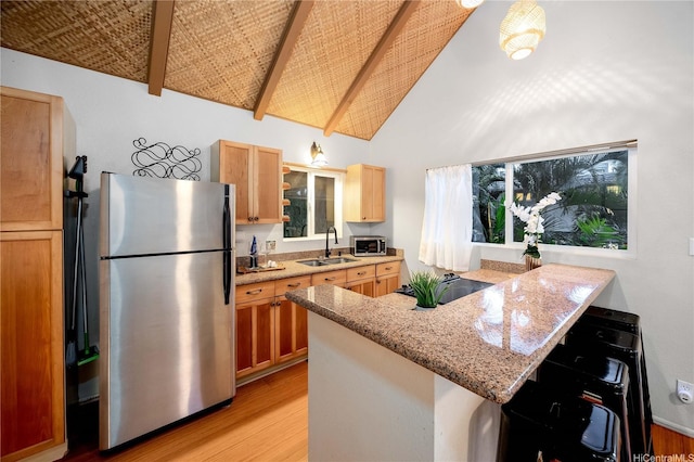1408 Auwaiku St, Kailua, HI 96734 - kitchen with stainless steel appliances, a sink, light wood-style flooring, a peninsula, and beam ceiling