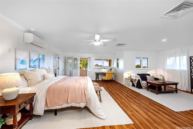 1408 Auwaiku St, Kailua, HI 96734 - bedroom with wood finished floors, a wall unit AC, and ceiling fan