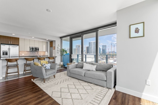 600 Ala Moana Blvd Unit 1101, Honolulu, HI 96813 - living area with wood finished floors, baseboards, a view of skyline, and recessed lighting