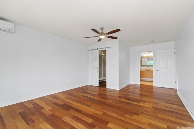 389D Kaelepulu Dr Unit 1504, Kailua, HI 96734 - spare room with wood finished floors, ceiling fan, baseboards, and a wall unit AC