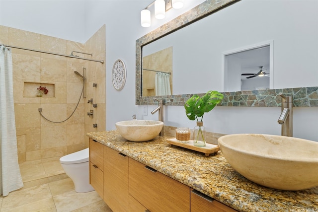 389D Kaelepulu Dr Unit 1504, Kailua, HI 96734 - bathroom featuring double vanity, tiled shower, toilet, and a ceiling fan