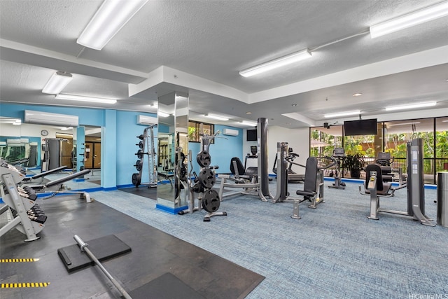 343 Hobron Ln Unit L103, Honolulu, HI 96815 - workout area featuring a textured ceiling, an AC wall unit, and carpet floors