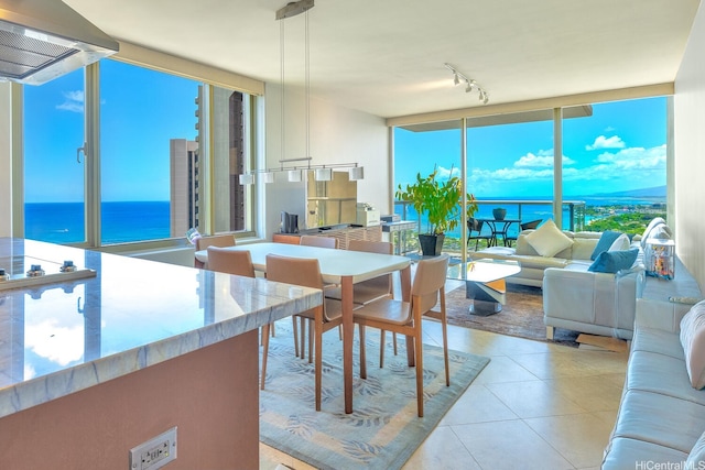 1551 Ala Wai Blvd Unit 2906, Honolulu, HI 96815 - dining room with light tile patterned floors, a water view, and floor to ceiling windows