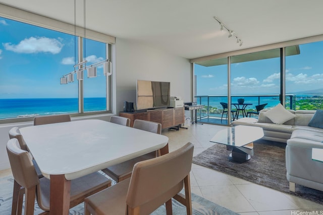 1551 Ala Wai Blvd Unit 2906, Honolulu, HI 96815 - dining room with rail lighting, floor to ceiling windows, tile patterned floors, and a water view