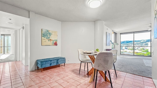 60 N Beretania St Unit 1702, Honolulu, HI 96817 - dining room featuring a textured ceiling, light tile patterned floors, and light carpet
