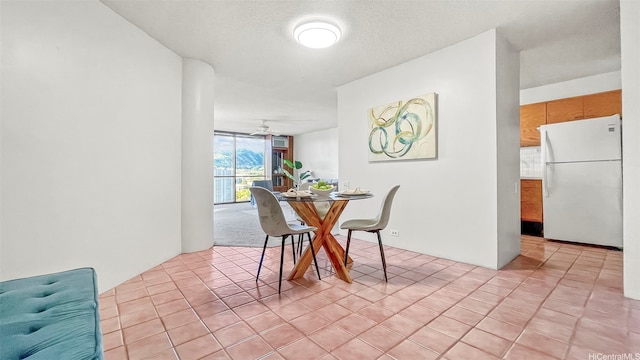 60 N Beretania St Unit 1702, Honolulu, HI 96817 - dining room featuring a ceiling fan, light tile patterned flooring, and a wall of windows