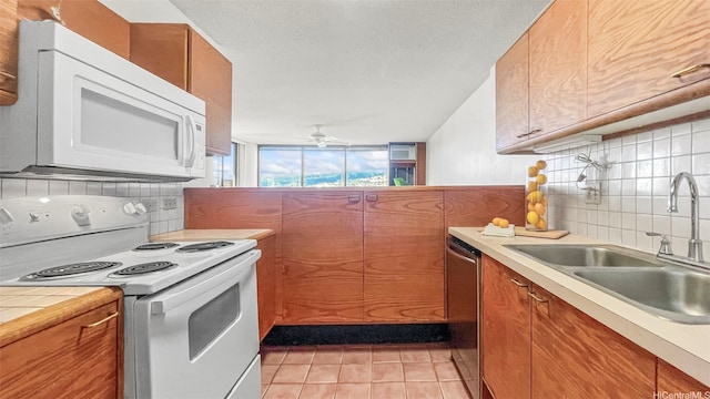 60 N Beretania St Unit 1702, Honolulu, HI 96817 - kitchen with white appliances, a sink, tasteful backsplash, and ceiling fan