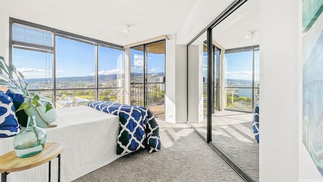 60 N Beretania St Unit 1702, Honolulu, HI 96817 - carpeted bedroom with floor to ceiling windows and access to outside