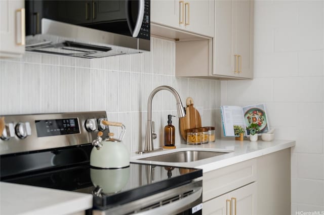 906 Lehua Ave Unit C301, Pearl City, HI 96782 - kitchen featuring stainless steel appliances, a sink, light countertops, and decorative backsplash