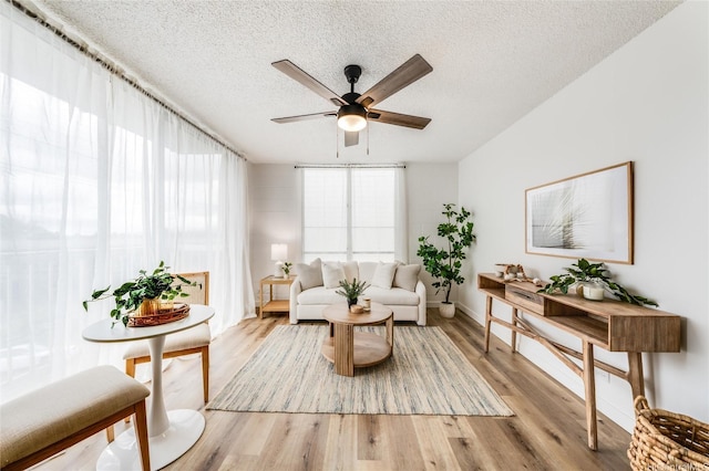 906 Lehua Ave Unit C301, Pearl City, HI 96782 - sitting room with ceiling fan, light wood-style flooring, a textured ceiling, and baseboards