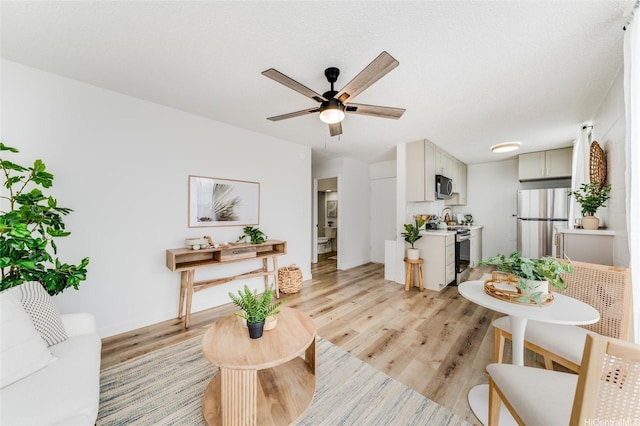 906 Lehua Ave Unit C301, Pearl City, HI 96782 - living area with light wood-style floors and a ceiling fan