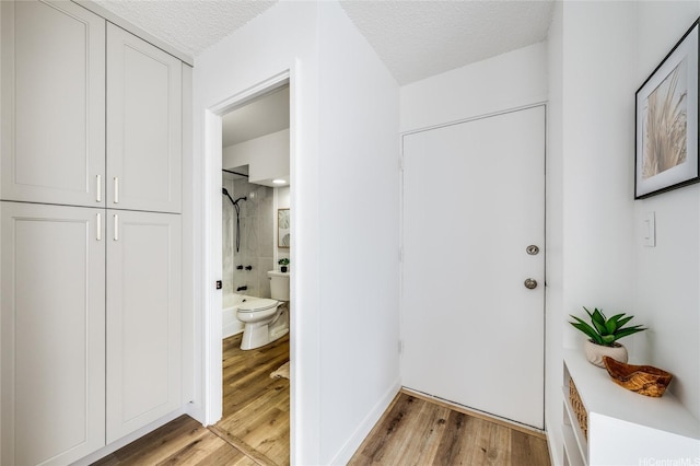 906 Lehua Ave Unit C301, Pearl City, HI 96782 - hall featuring light wood finished floors and a textured ceiling