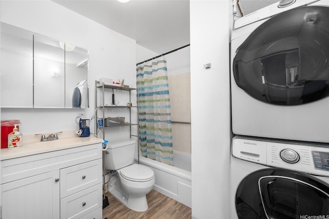 2474 Kapiolani Blvd Unit 1601, Honolulu, HI 96826 - bathroom with stacked washer and clothes dryer, vanity, toilet, wood finished floors, and shower / bath combo