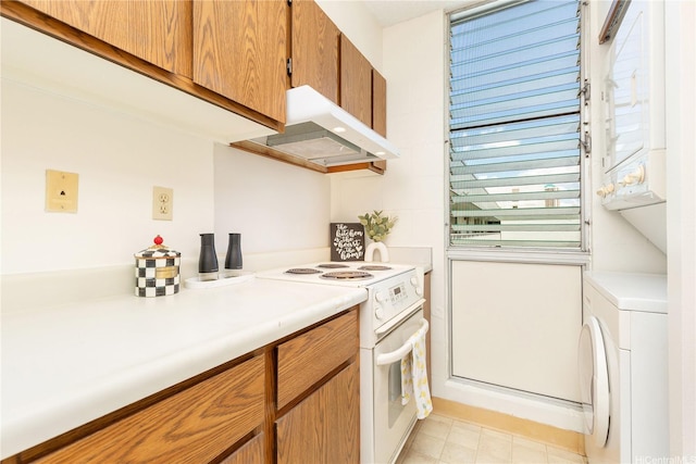 1122 Elm St Unit 809, Honolulu, HI 96814 - kitchen featuring white electric range oven, extractor fan, washer / clothes dryer, light countertops, and brown cabinetry
