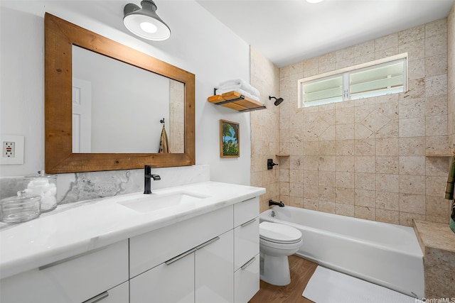 464 Poipu Dr, Honolulu, HI 96825 - bathroom featuring toilet, vanity, tub / shower combination, and wood finished floors