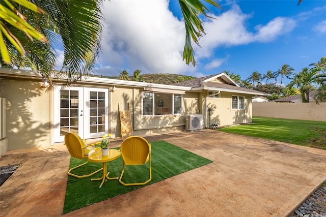 464 Poipu Dr, Honolulu, HI 96825 - back of property with stucco siding, ac unit, french doors, and a patio